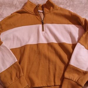 gold and white quarter zip